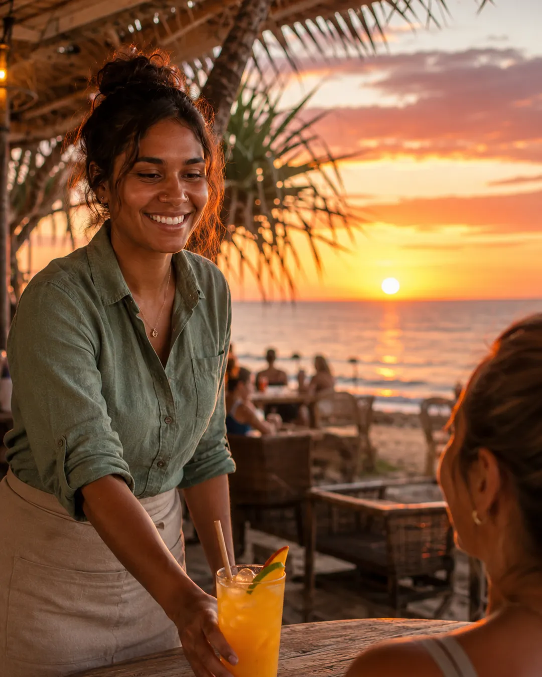 A bartender serving customers in a Northern Territory venue.